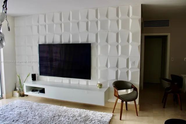 a living room with a couch and a fireplace