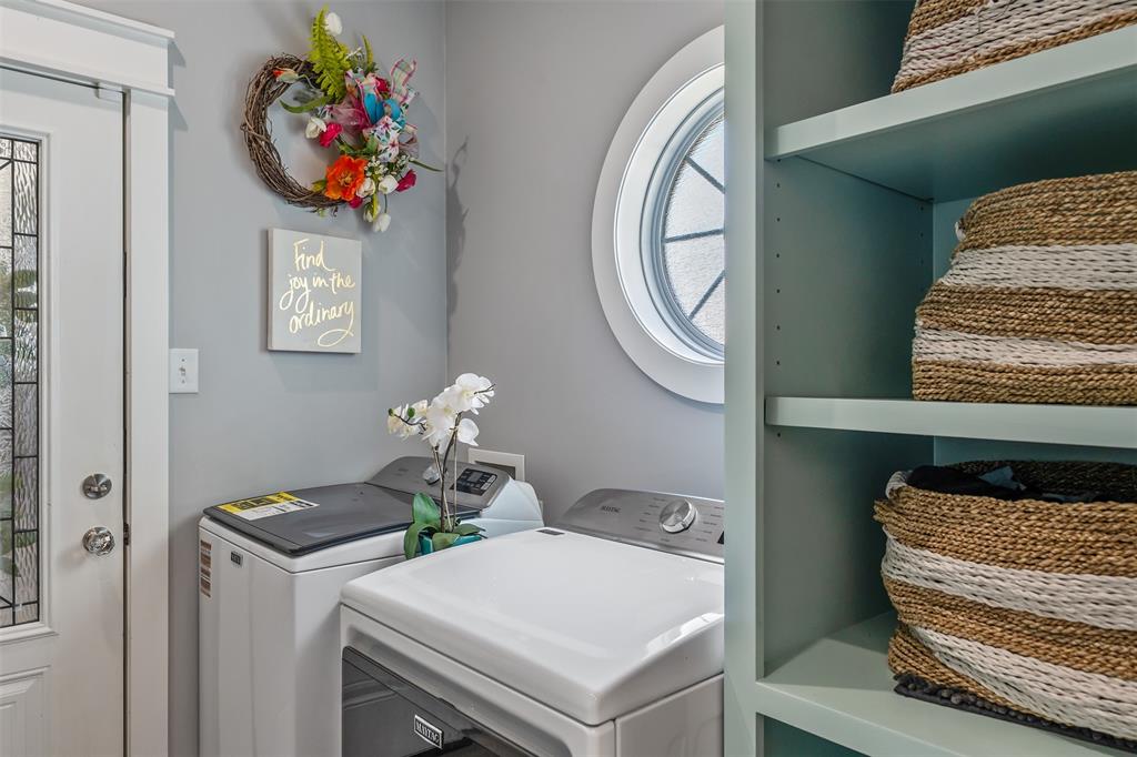 16241 Big Oak Bay Road Tyler, TX 75707 - Photo 13 of 40 Dedicated laundry area featuring a full-light entry door with decorative glass, a prominent round window, and built-in shelving