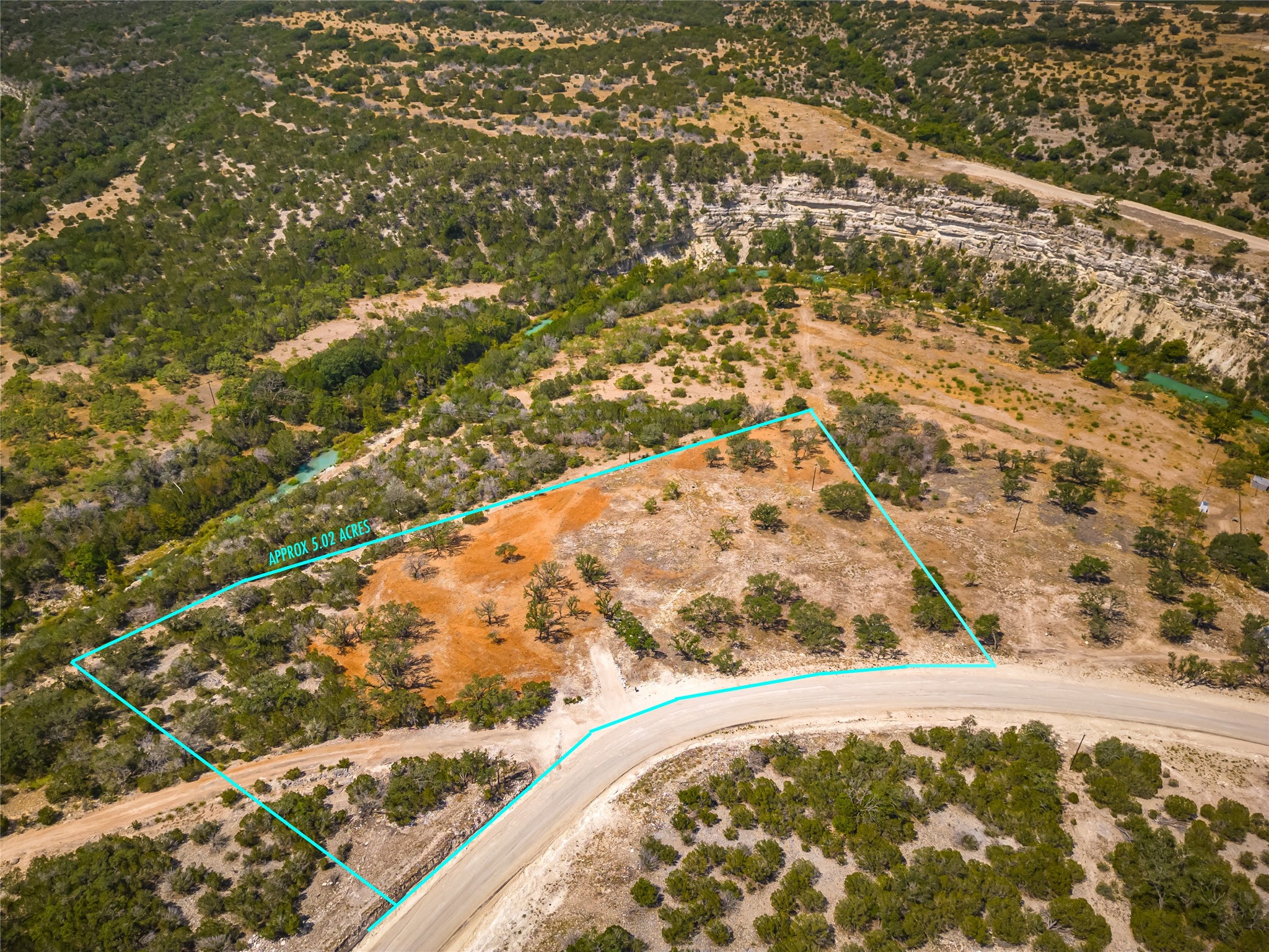 Lot 20 Seven Spring Dr Junction, Unit LOT 20 Junction, TX 76849 - Photo 32 of 40 an aerial view of residential houses with outdoor space