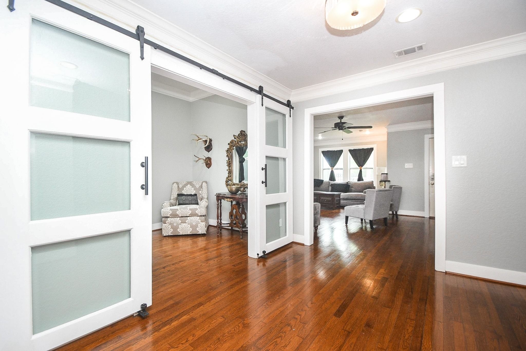 614 West 28th Street Houston, TX 77008 - Photo 18 of 25 Beautiful crown molding and sliding barn doors.