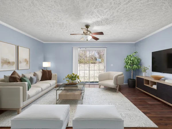 a living room with furniture and a flat screen tv