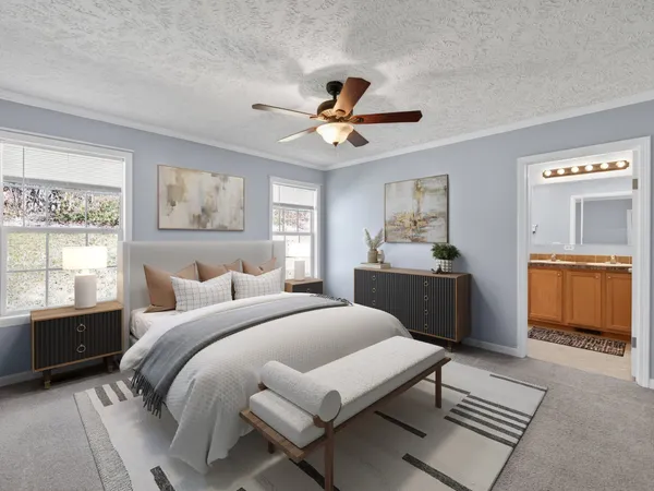 a bedroom with a bed and a chandelier fan