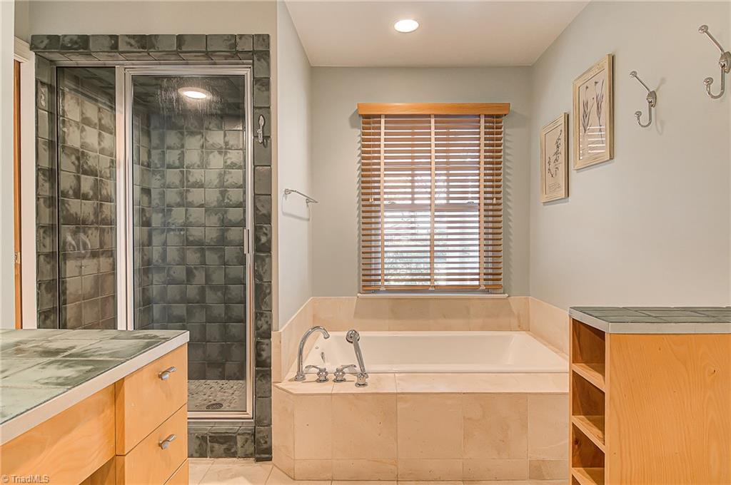 540 Arbor Road Winston-Salem, NC 27104 - Photo 22 of 30 Tiled steam shower and cast iron soaking tub