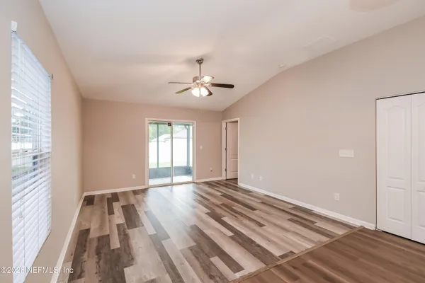 a view of an empty room with a window