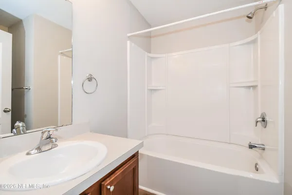 a bathroom with a sink and a bathtub