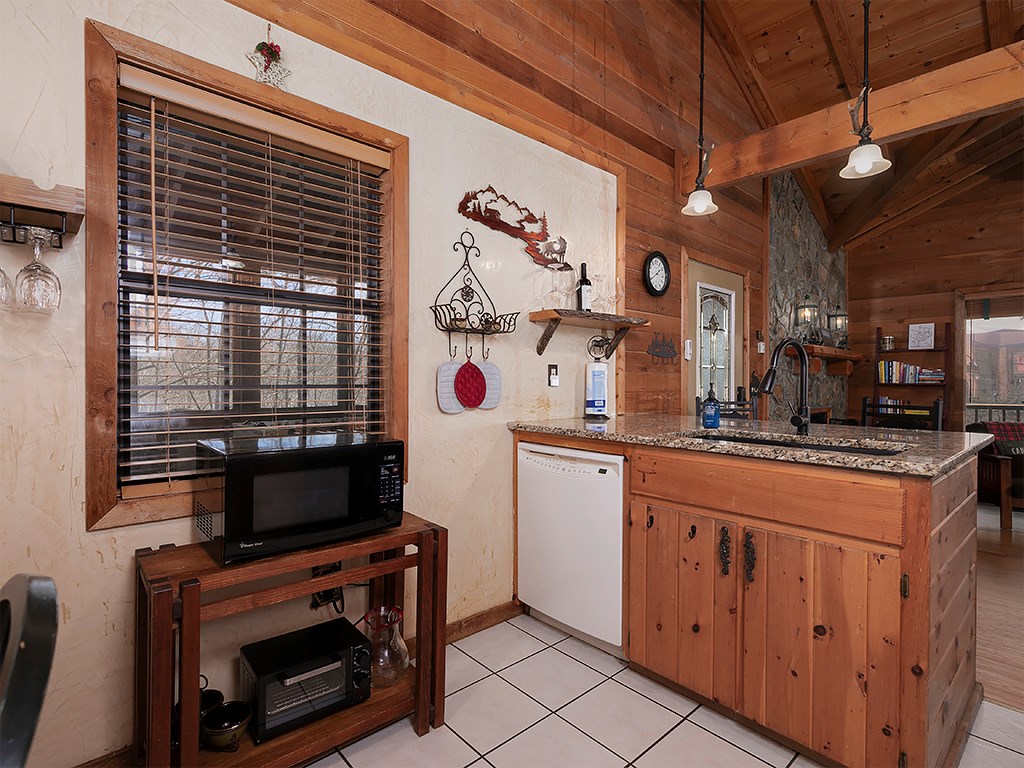 287 Cheyenne Trail Blue Ridge, GA 30513 - Photo 25 of 53 a kitchen with stainless steel appliances granite countertop a stove and a sink