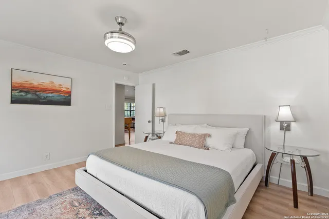 a bedroom with a bed and a lamp