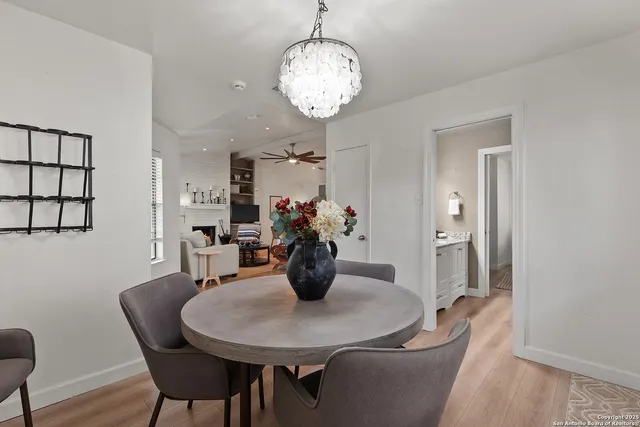 a dining room with furniture and wooden floor