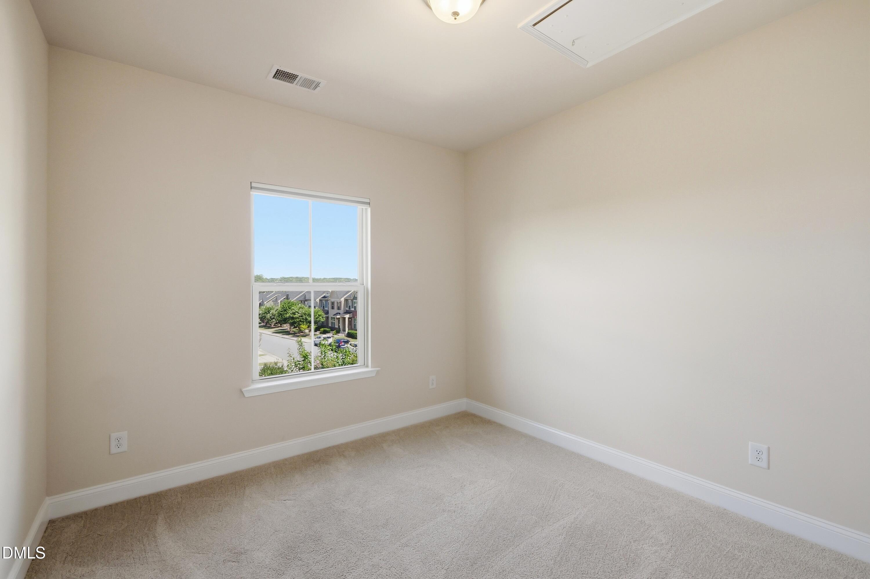 1004 Waymaker Court Apex, NC 27502 - Photo 20 of 30 an empty room with a window