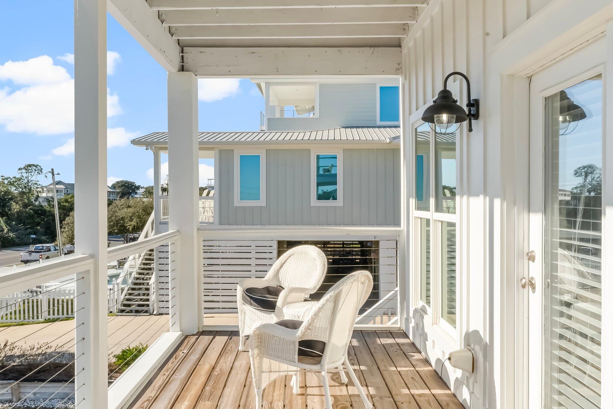 6126 West County Highway 30A Santa Rosa Beach, FL 32459 - Photo 15 of 76 a view of a balcony with furniture and floor to ceiling window
