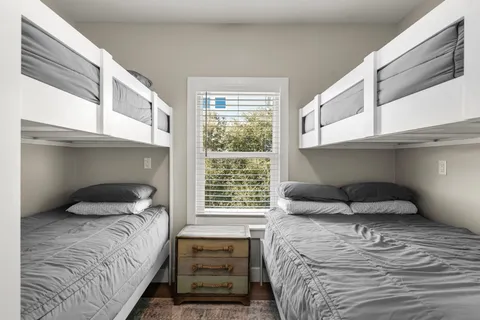 a room with a bed and a window