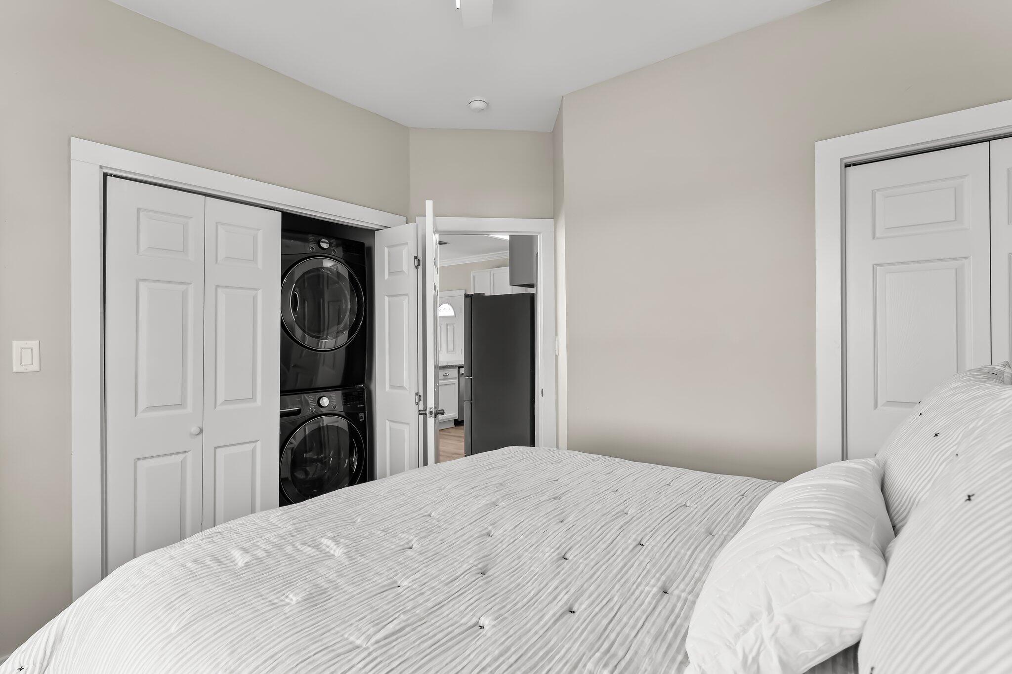 6126 West County Highway 30A Santa Rosa Beach, FL 32459 - Photo 22 of 76 a bedroom with a bed and a refrigerator