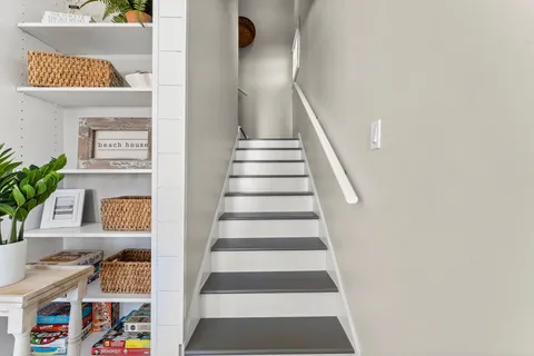 a spacious bedroom with a large bed and a large window