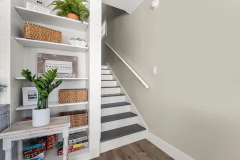 a bedroom with a large bed and a ceiling fan