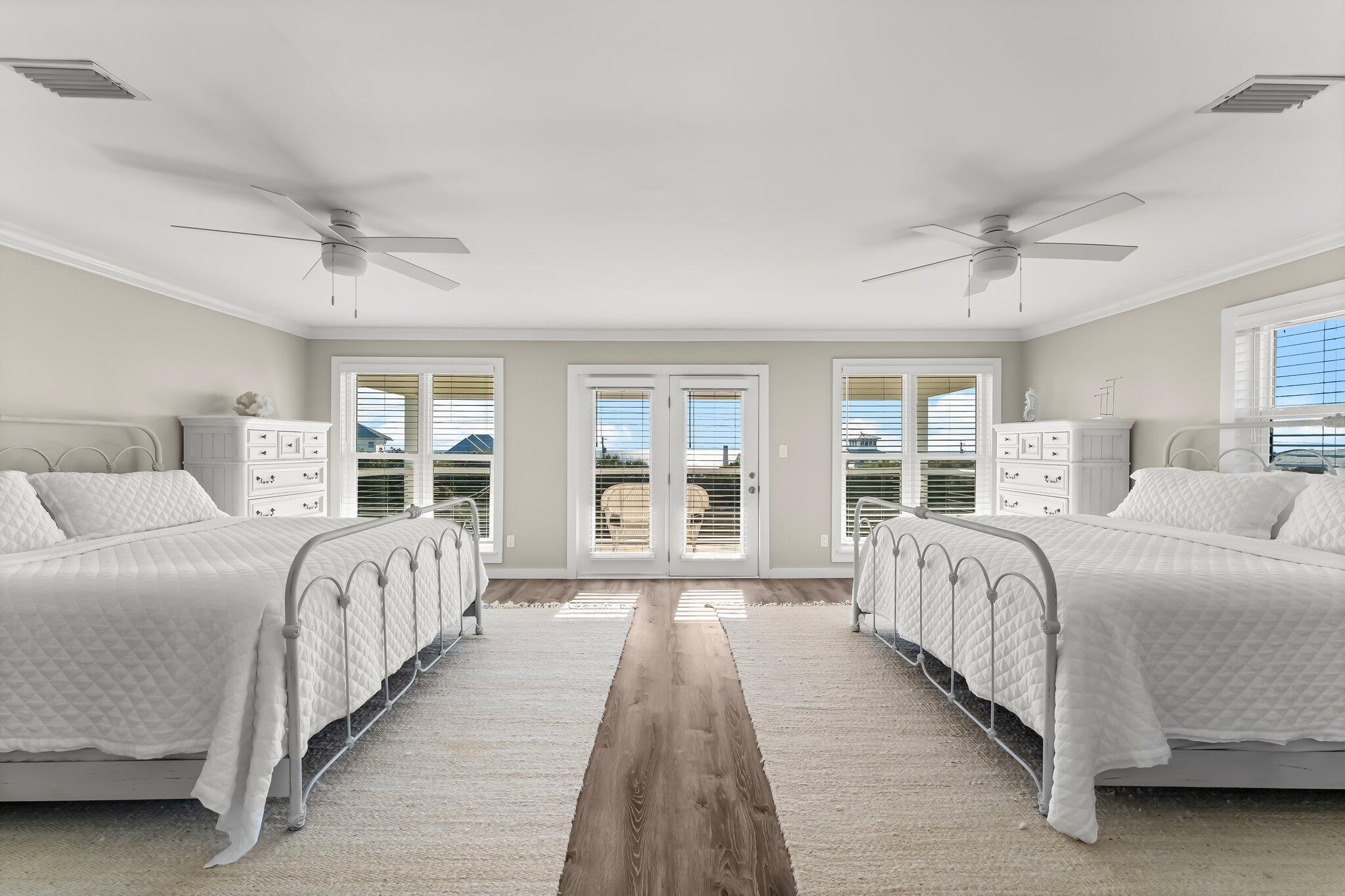 6126 West County Highway 30A Santa Rosa Beach, FL 32459 - Photo 25 of 76 a bedroom with a large bed and a window