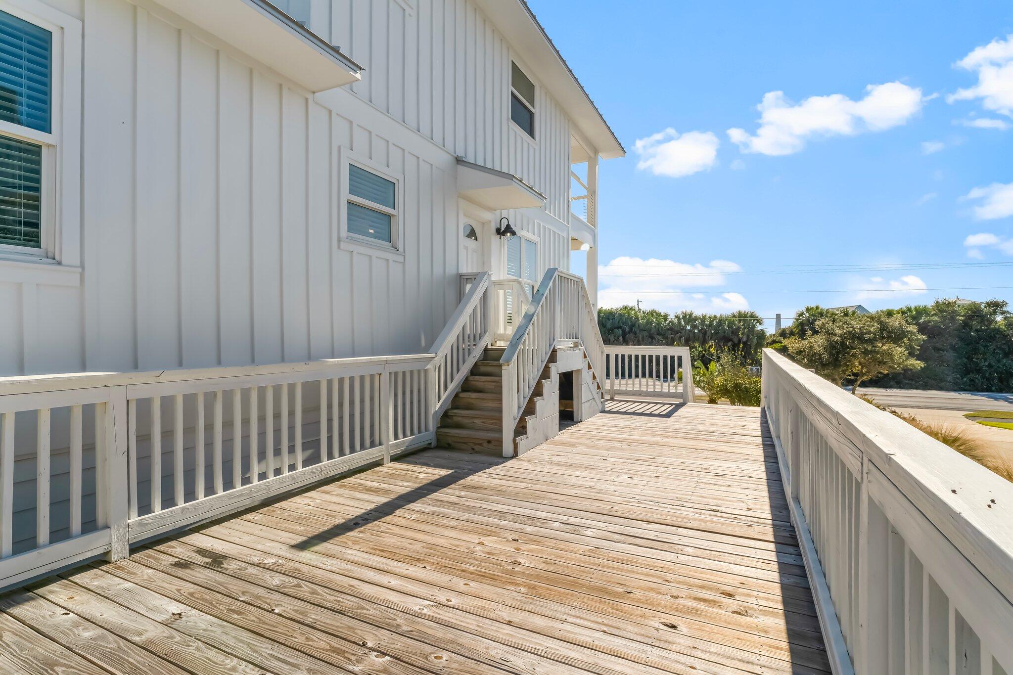 6126 West County Highway 30A Santa Rosa Beach, FL 32459 - Photo 44 of 76 a view of a balcony with wooden floor and fence
