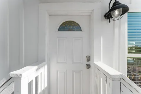 a view of multiple houses with a street