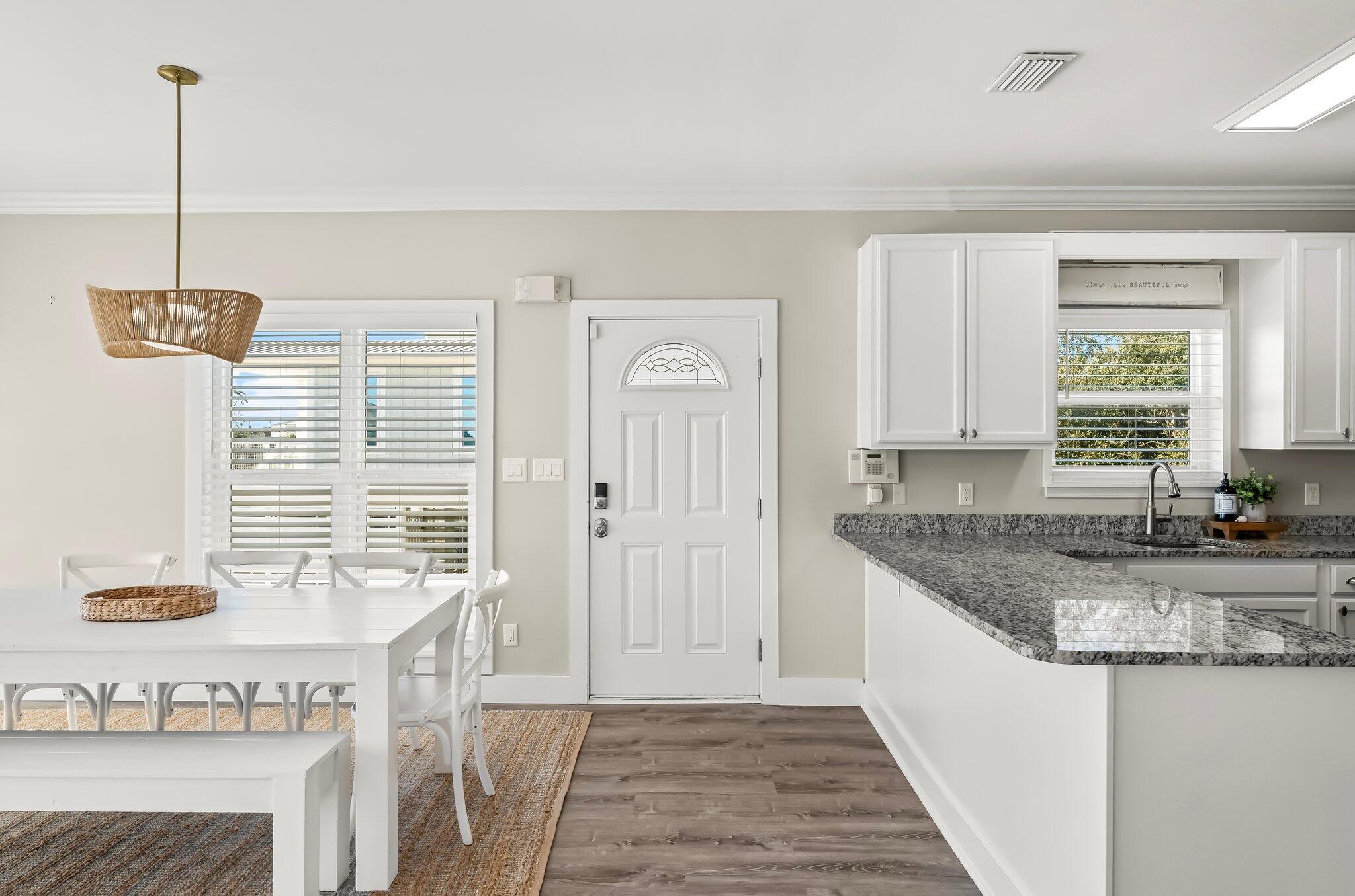 6126 West County Highway 30A Santa Rosa Beach, FL 32459 - Photo 9 of 76 a kitchen with granite countertop a sink a counter and cabinets