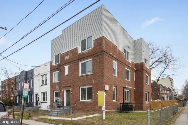 a front view of a building with garden