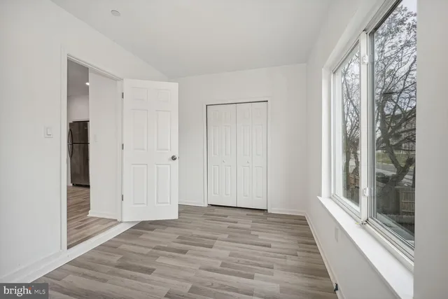 a view of a room with wooden floor and gate