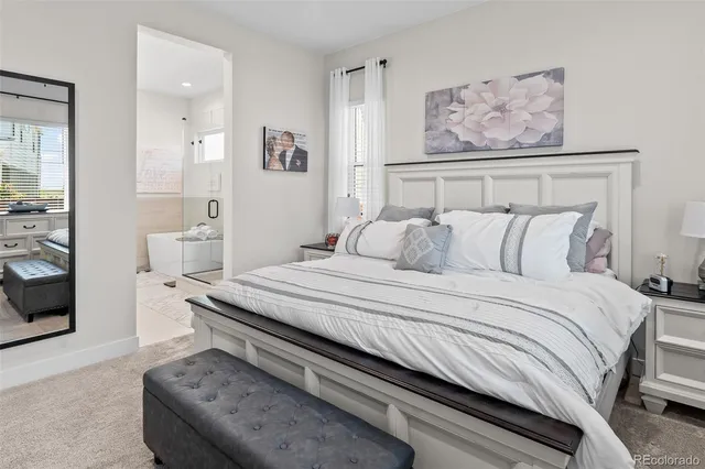 a bedroom with a bed and glass wall