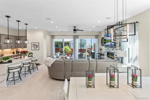 a living room with lots of furniture and a chandelier