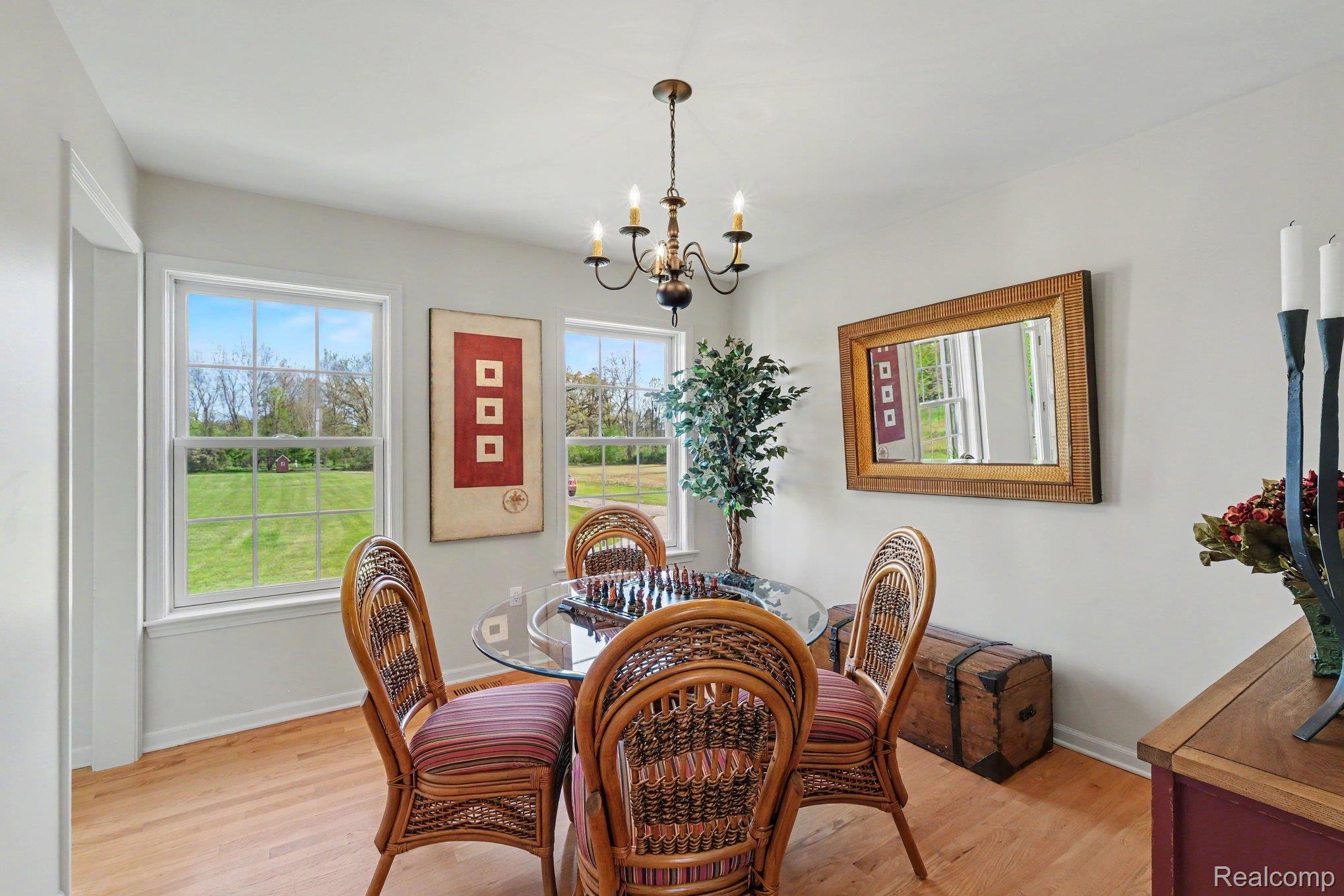 6520 Cook Road Swartz Creek, MI 48473 - Photo 20 of 43 Dining room featuring suspended lighting and light wood-type flooring