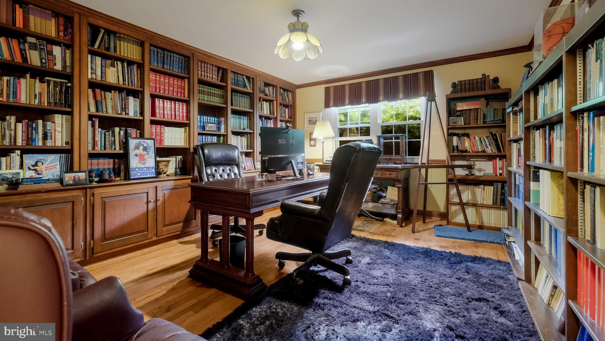 1591 Middletown Road Glen Mills, PA 19342 - Photo 18 of 55 a view of a workspace with furniture and a bookshelf