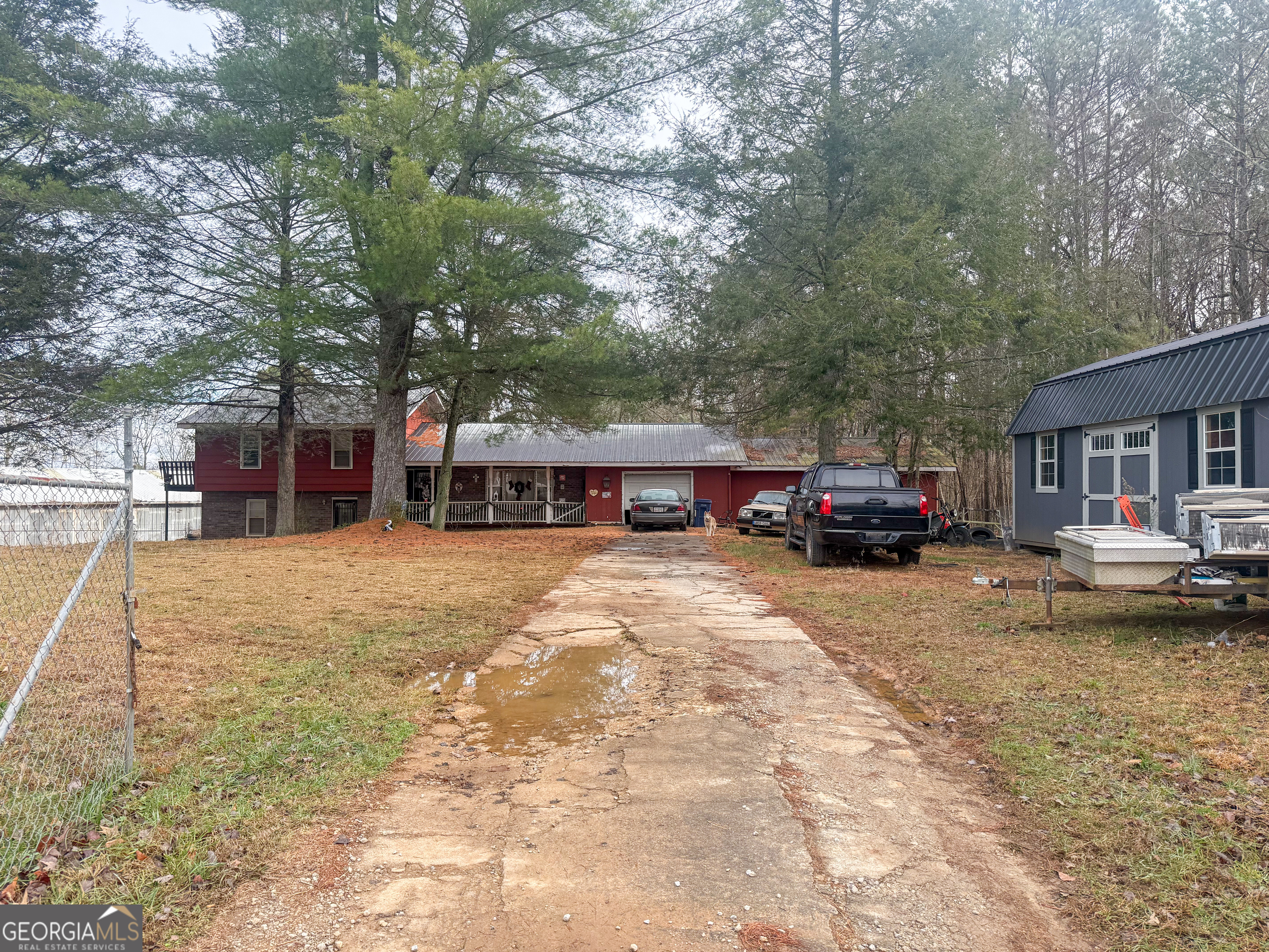a view of a house with truck parked in front of a house