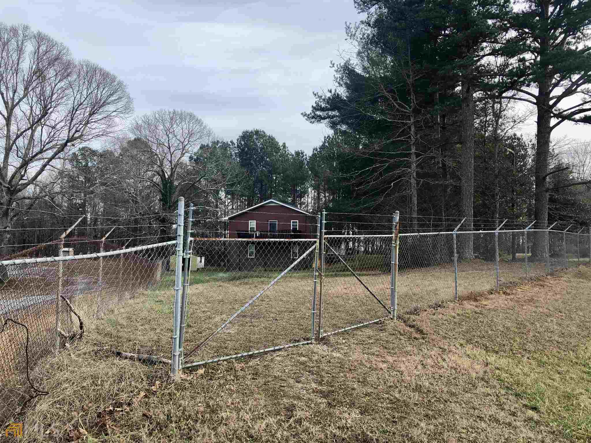 3750 Old Cleveland Road Cornelia, GA 30531 - Photo 9 of 9 a backyard of a house with lots of green space
