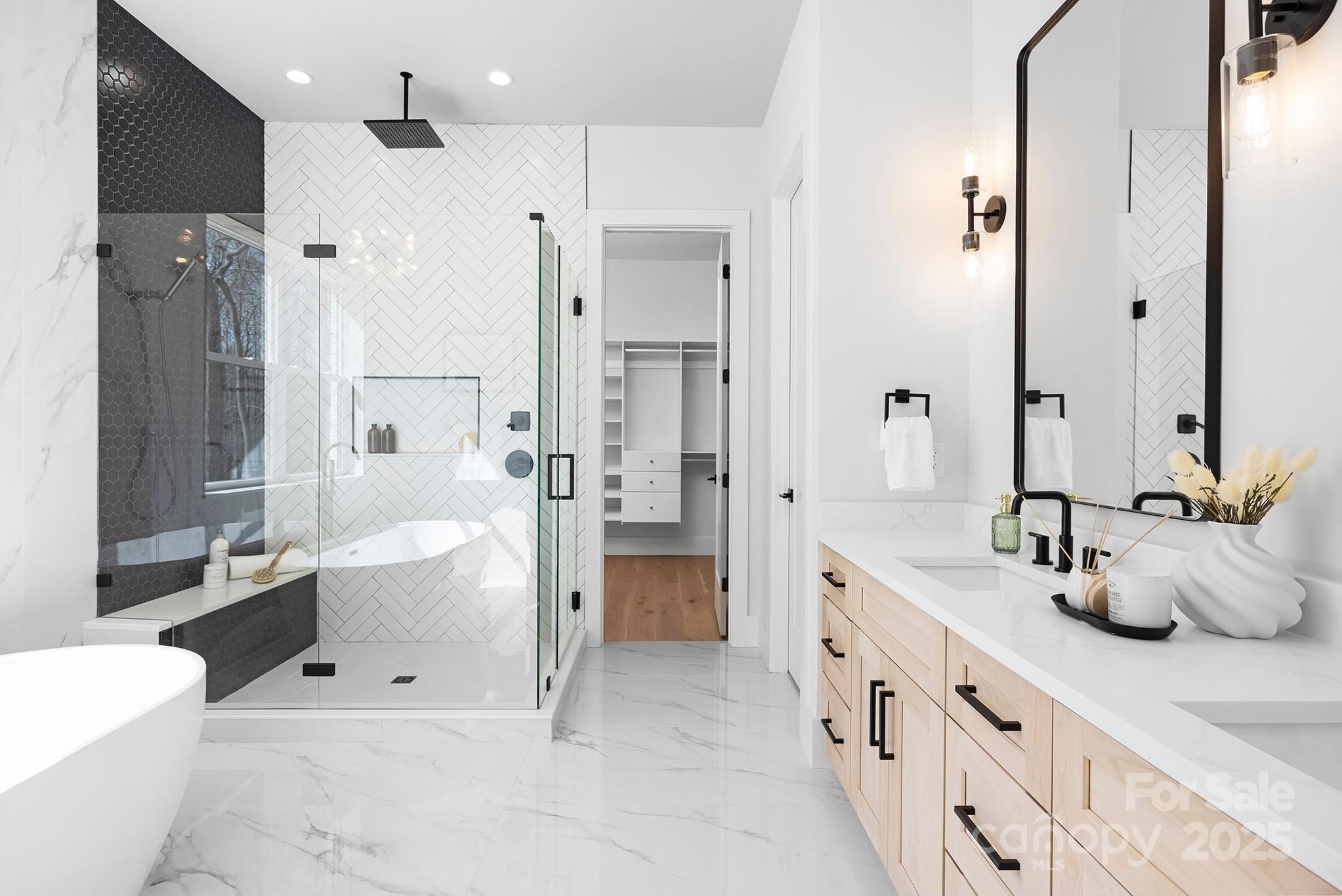 12011 Brief Road Charlotte, NC 28227 - Photo 11 of 12 a large bathroom with a tub sink shower and mirror