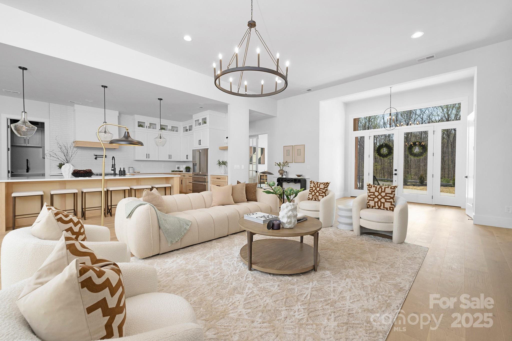 12011 Brief Road Charlotte, NC 28227 - Photo 3 of 12 a living room with furniture and a chandelier