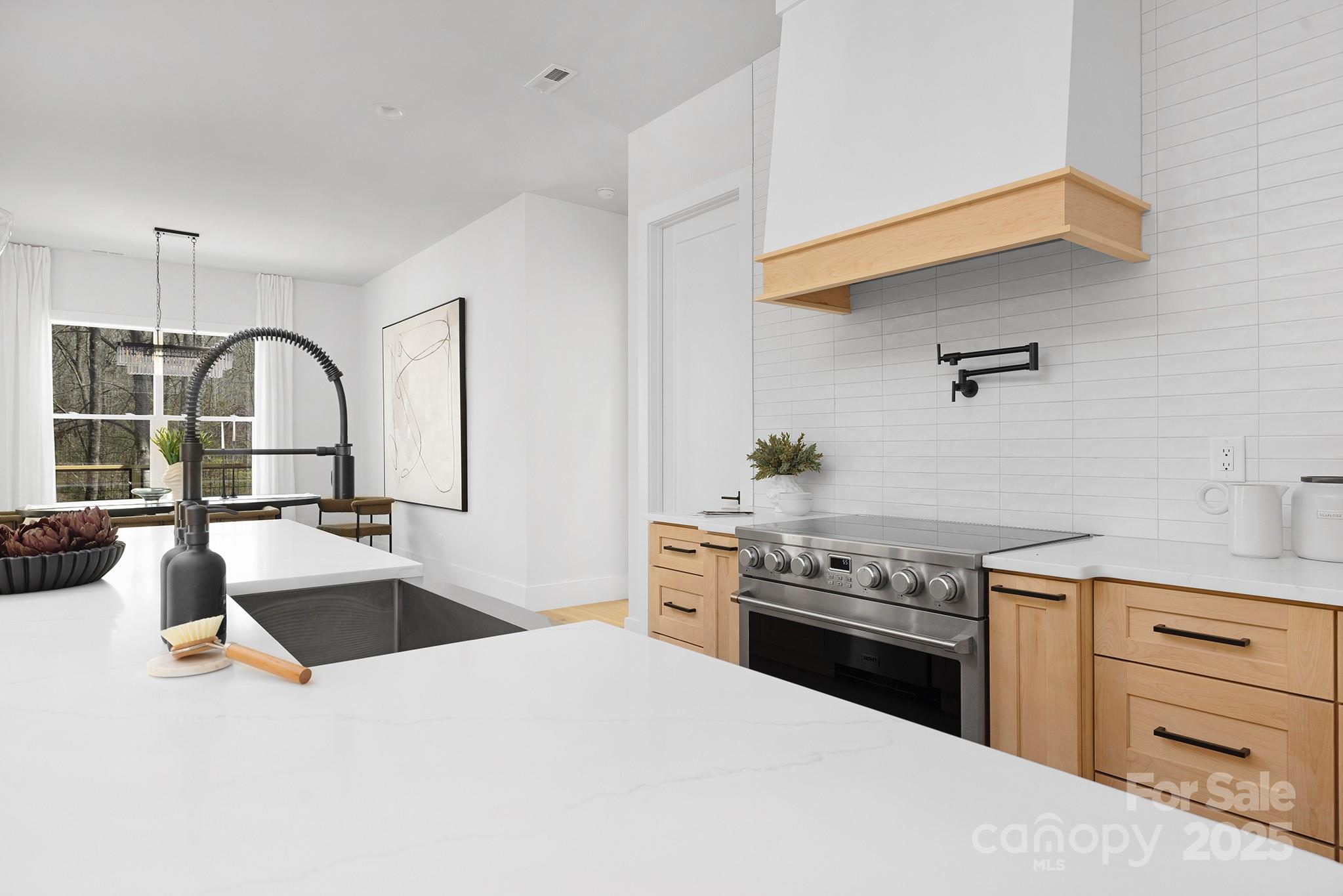 12011 Brief Road Charlotte, NC 28227 - Photo 5 of 12 a kitchen with a sink stove and refrigerator