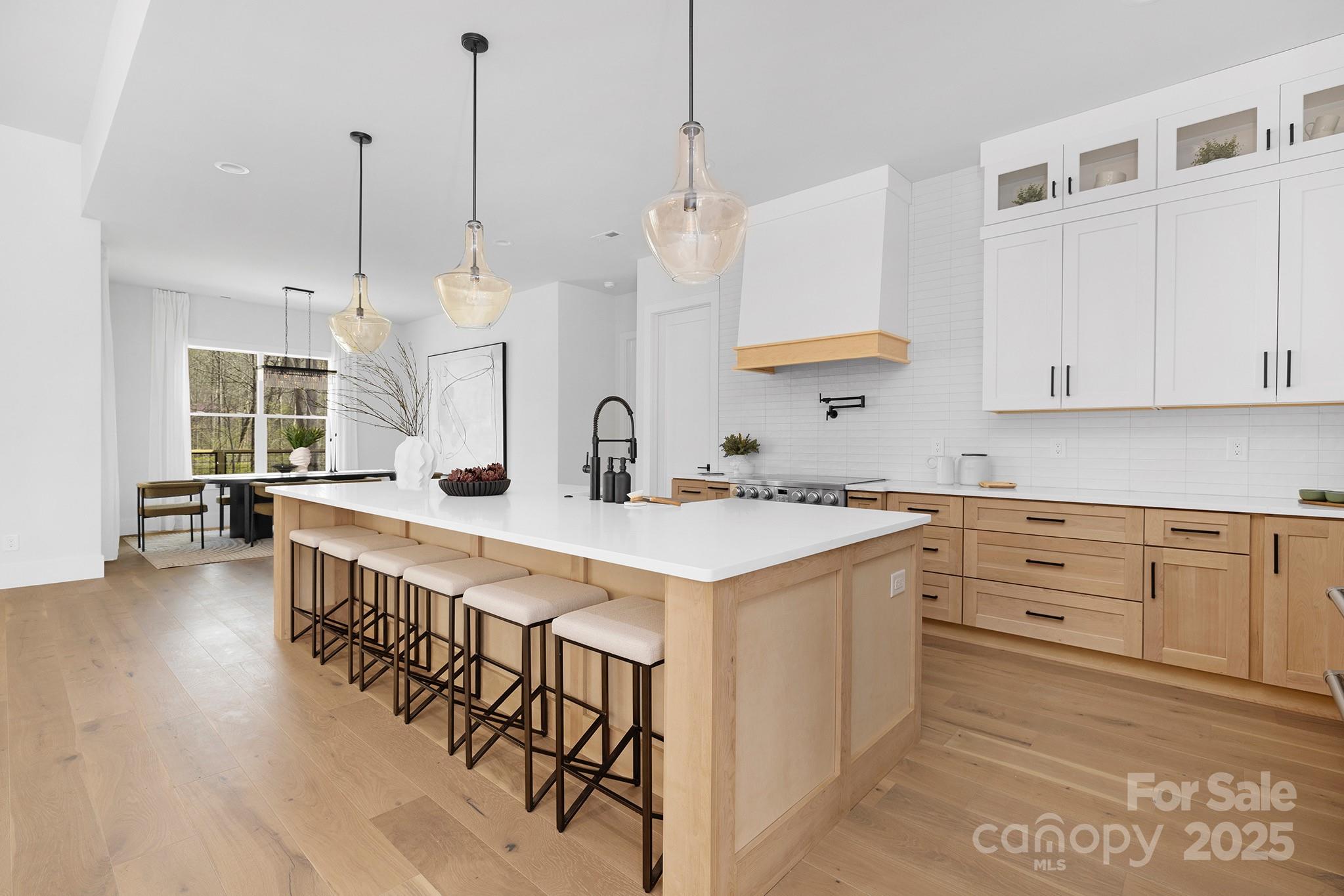 12011 Brief Road Charlotte, NC 28227 - Photo 7 of 12 a kitchen with kitchen island granite countertop a sink a counter top space and stainless steel appliances