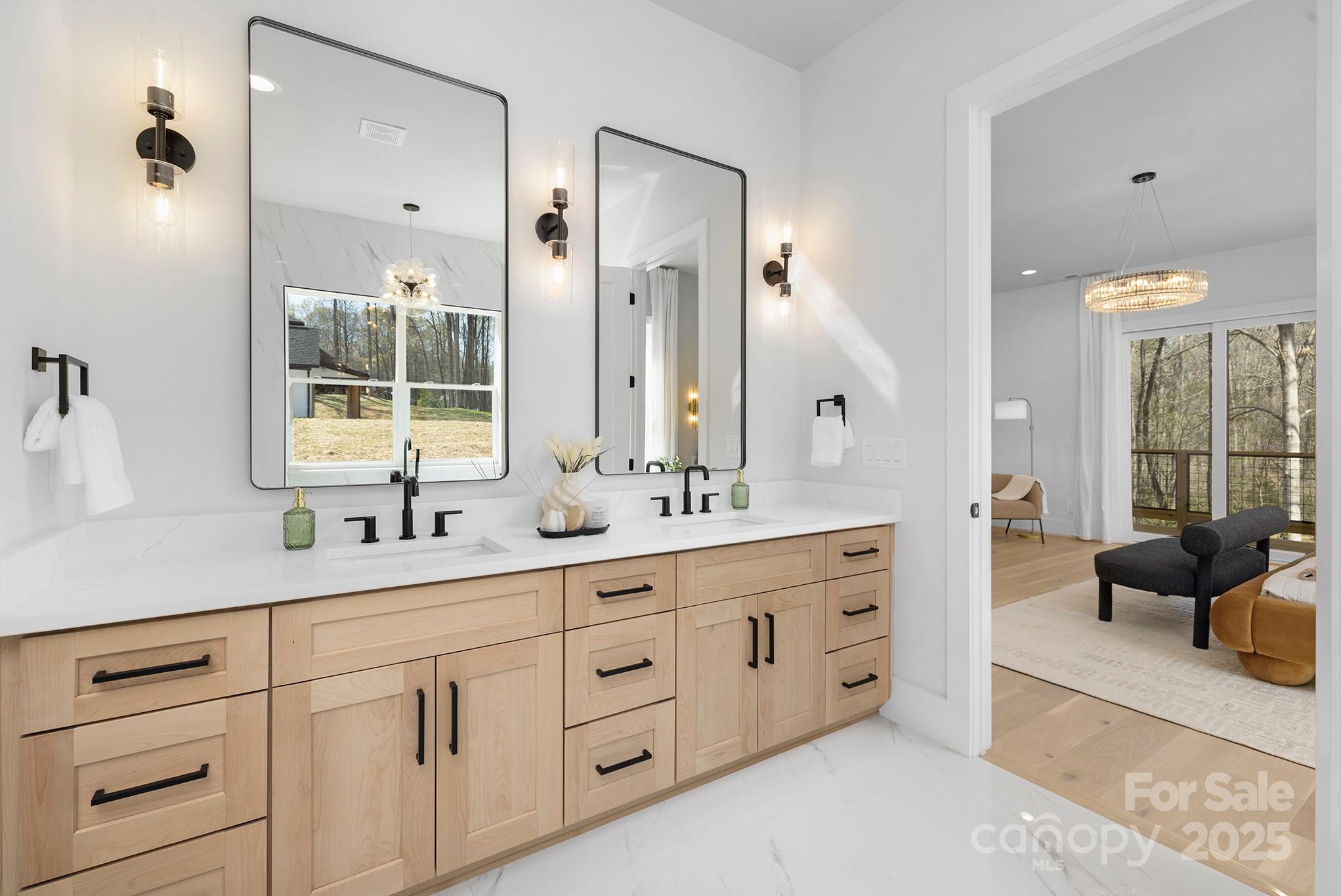 12011 Brief Road Charlotte, NC 28227 - Photo 10 of 12 a spacious bathroom with double sink a large mirror and a shower