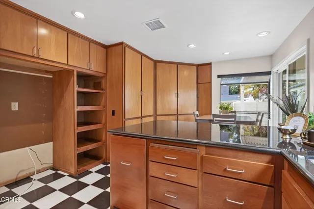 a bed room with a bed and a chandelier