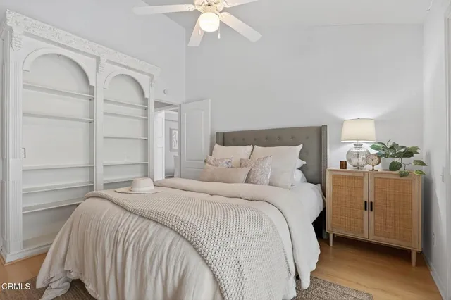 a spacious bathroom with a shower a sink and a mirror