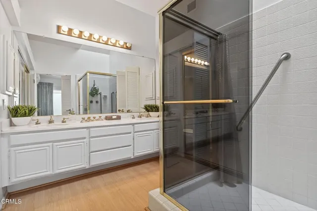 a bathroom with a shower and closet