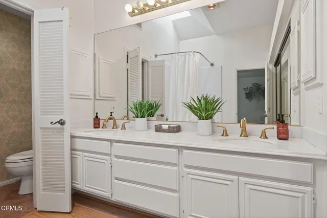 a bathroom with a tub sink and a mirror