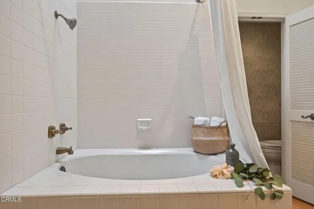 a bathroom with a sink a bathtub and a shower