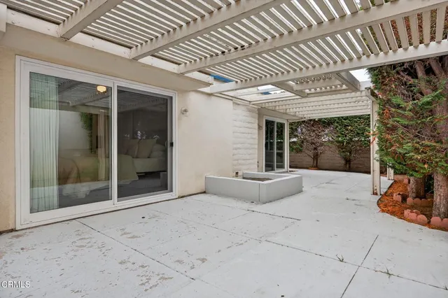 a patio with table and chairs