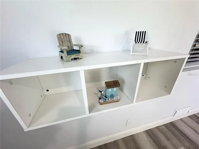 a view of kitchen with furniture and wooden floor