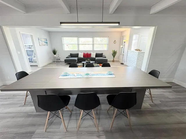 a view of a dining room with furniture and window