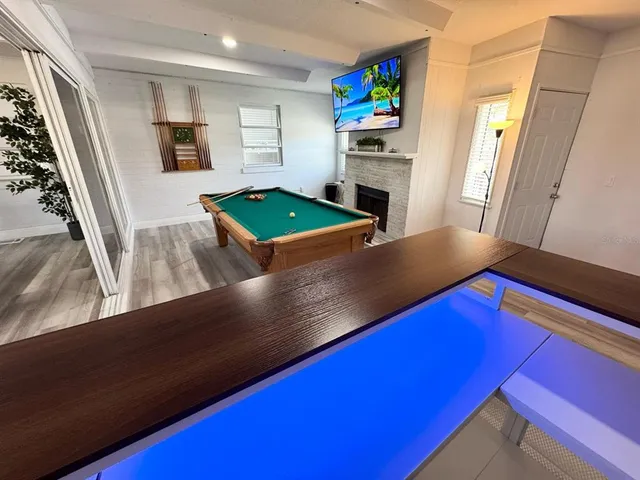 a kitchen with stainless steel appliances a refrigerator sink and stove