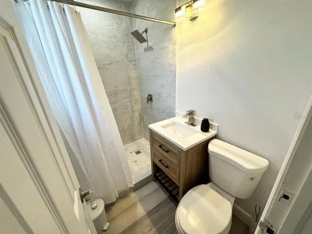 a bathroom with a sink and toilet