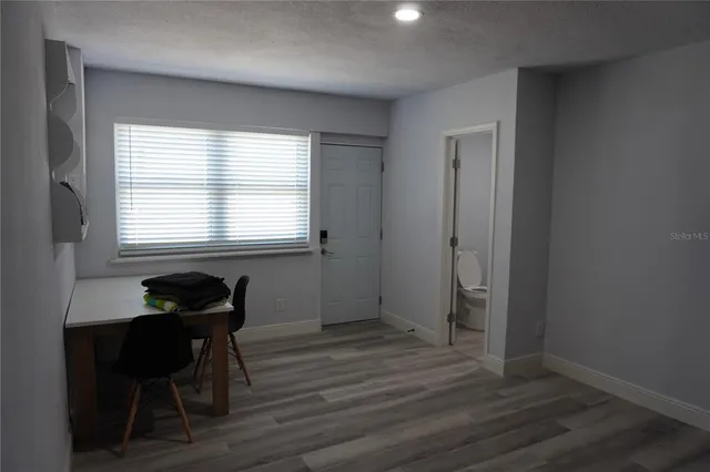 a room that has a window and a table in it