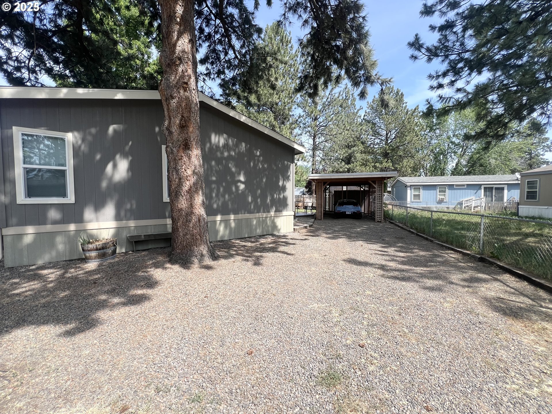 1809 26th Street, Unit 12 La Grande, OR 97850 - Photo 15 of 16 a front view of a house with a yard