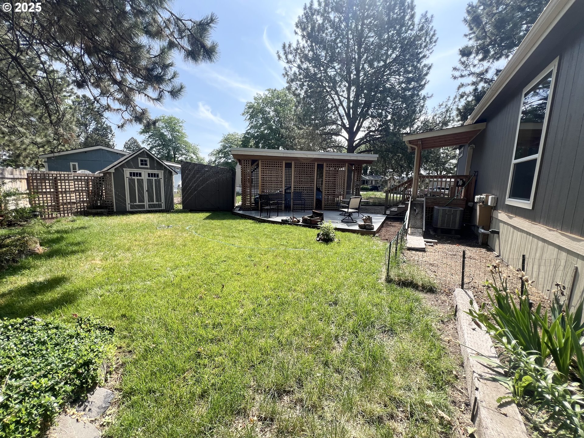1809 26th Street, Unit 12 La Grande, OR 97850 - Photo 2 of 16 a view of a house with backyard and sitting area
