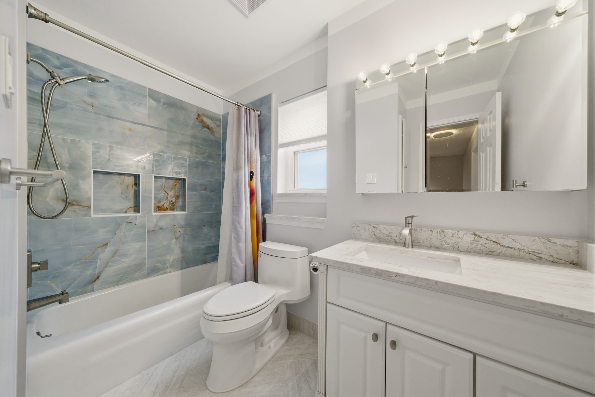 6452 Burgoyne Road, Unit 100 Houston, TX 77057 - Photo 31 of 44 a bathroom with a granite countertop sink toilet and shower