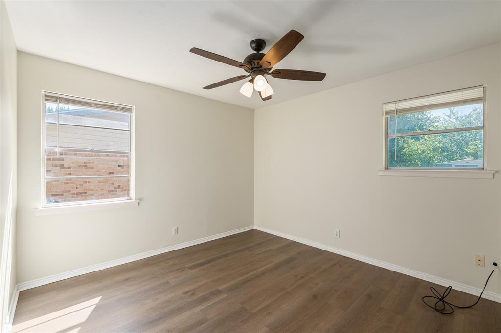 604 Pershing Drive Denton, TX 76209 - Photo 12 of 24 a view of an empty room with a window